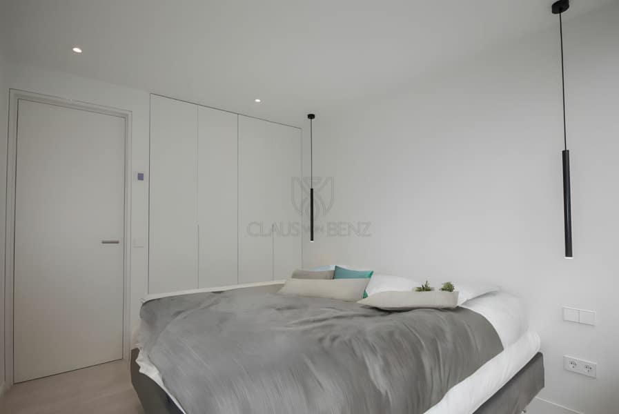 luxury penthouse sea view bedroom with built-in wardrobe